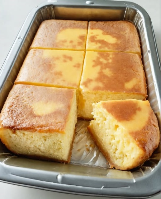 Super Easy Rice Cake (Milk Custard Cake) with a smooth, golden top and a soft, creamy texture.