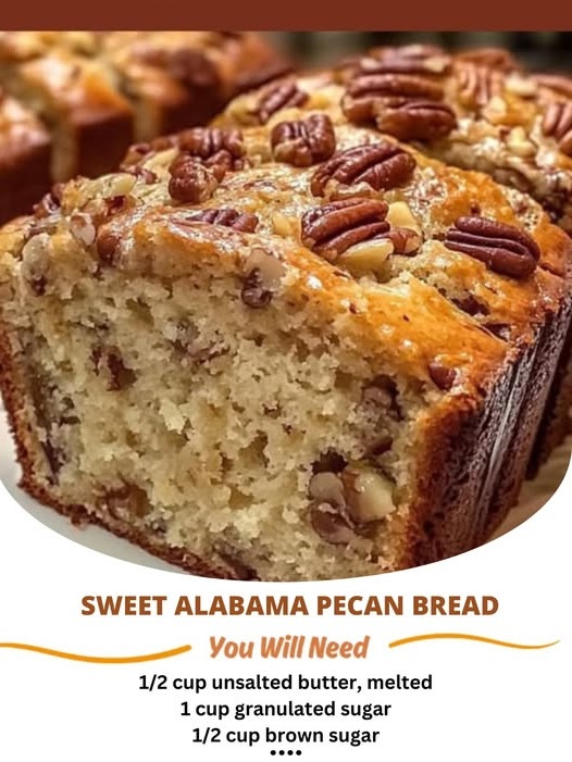 Golden-brown slices of Sweet Alabama Pecan Bread with visible chunks of pecans, sitting on a rustic wooden table