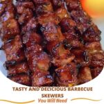 Grilled barbecue skewers with juicy meat and vegetables on a wooden board, garnished with herbs.