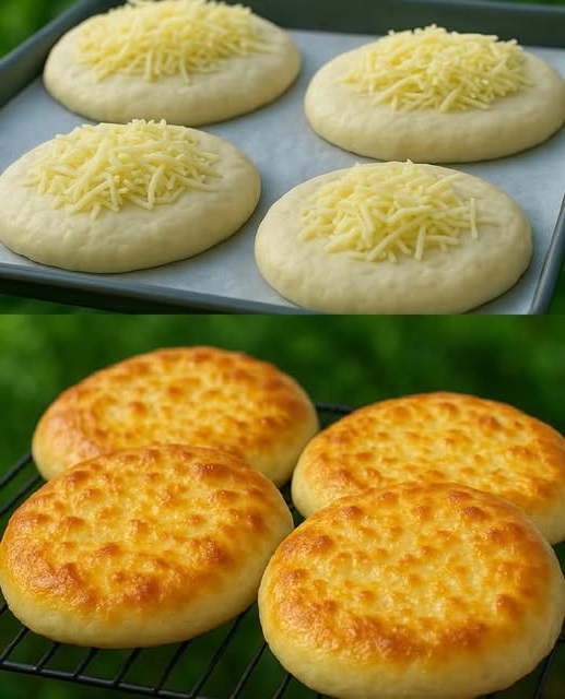 A rustic loaf of golden-brown cheesy bread with a crisp crust and melted cheese pockets visible on the surface.