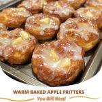 Warm, golden baked apple fritters with a sweet, cinnamon-spiced apple filling, dusted with powdered sugar. The perfect fall treat.