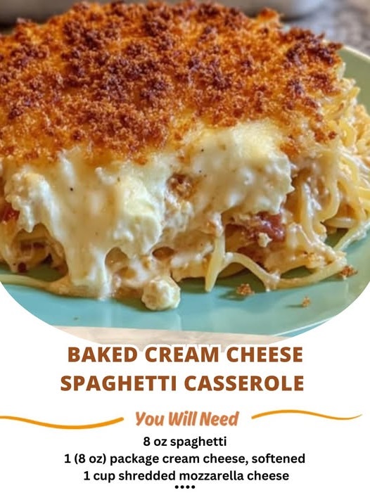 A serving of baked cream cheese spaghetti casserole, with melted cheese on top, rich tomato sauce, and creamy pasta layers.