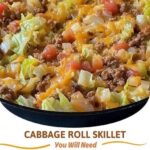 A hearty skillet filled with chopped cabbage, ground beef, rice, and tomato sauce, simmered together and garnished with fresh parsley.