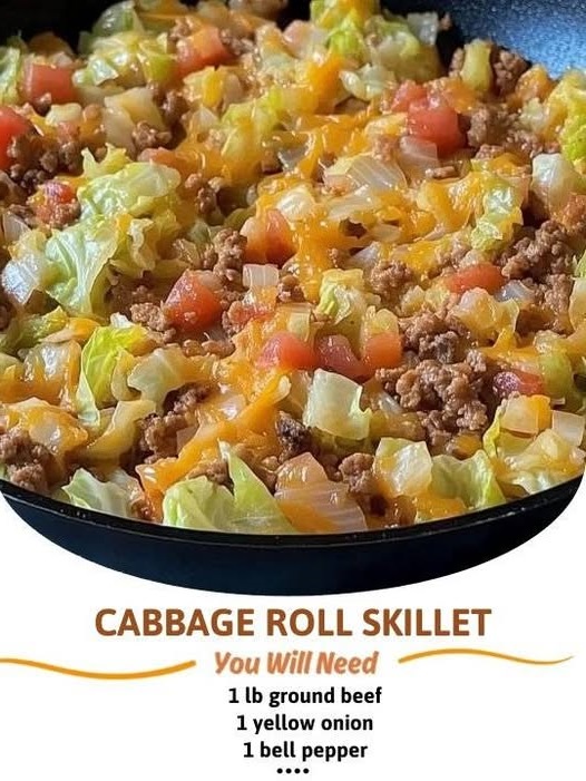 A hearty skillet filled with chopped cabbage, ground beef, rice, and tomato sauce, simmered together and garnished with fresh parsley.