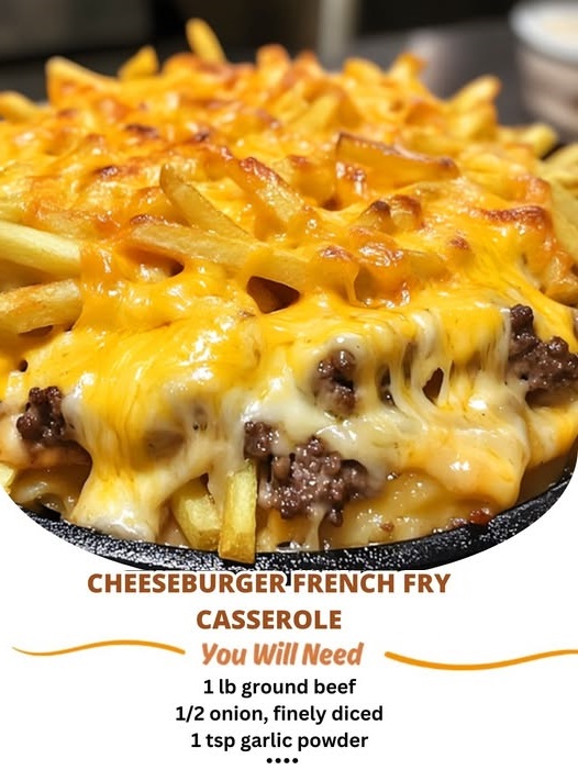 Baked casserole topped with golden French fries, melted cheese, and ground beef in a baking dish.