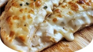 Golden, crispy chicken alfredo air fryer calzones filled with creamy alfredo sauce, chicken, and melted cheese.
