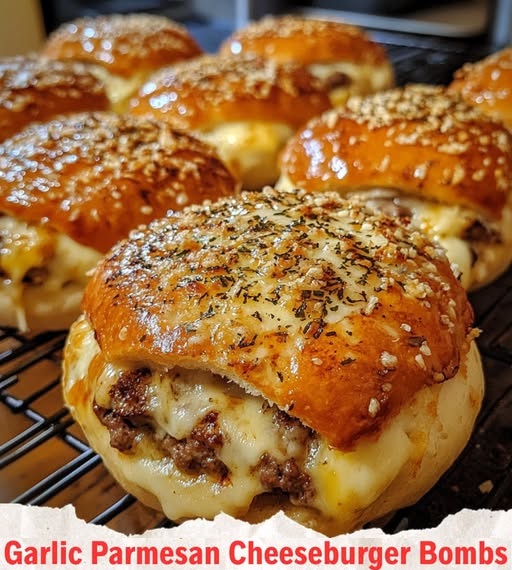 Golden, bite-sized cheeseburger bombs stuffed with melted cheese and seasoned beef, coated in garlic butter and parmesan, ready to be enjoyed.