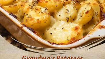 Golden, creamy mashed potatoes with a rich buttery finish, garnished with chopped parsley and served in a rustic bowl.