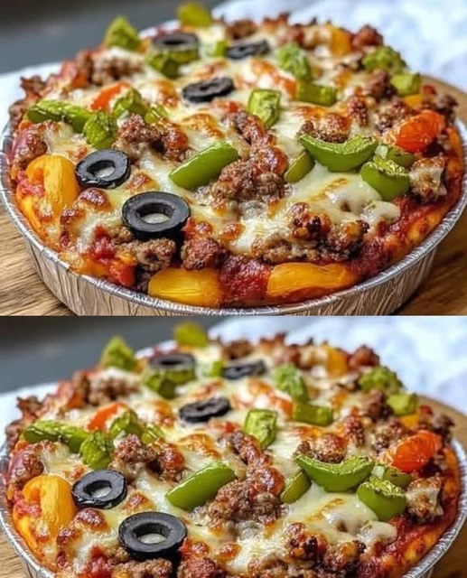A savory low-carb crustless pizza bowl filled with layers of melted cheese, pepperoni, vegetables, and marinara sauce, served in a bowl ready to be enjoyed.