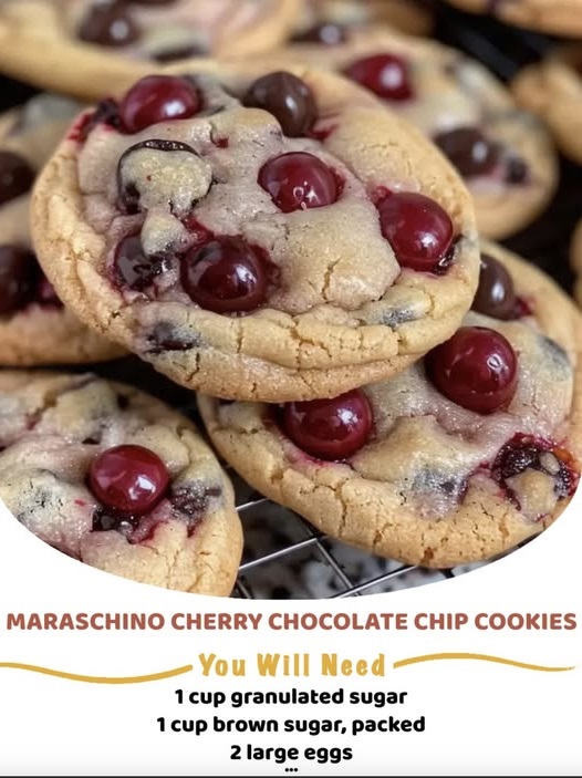 Soft cookies studded with chocolate chips and chopped maraschino cherries, stacked on a plate with a glossy red cherry on top.
