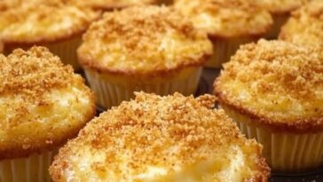 Golden brown cheddar crumbly puffs baked in a muffin pan, topped with crispy cheese and savory crumbs.