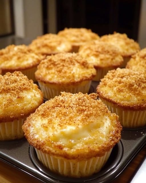 Golden brown cheddar crumbly puffs baked in a muffin pan, topped with crispy cheese and savory crumbs.