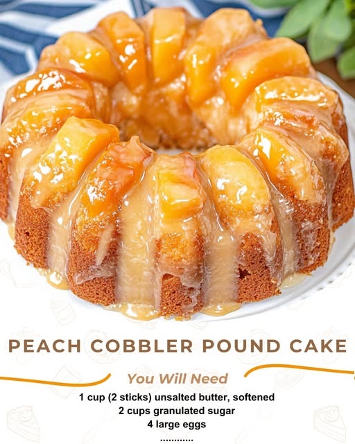 "A thick slice of peach cobbler pound cake topped with a peach glaze and caramelized peach slices, sitting on a white plate with a fork beside it."
