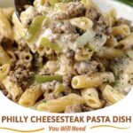 Creamy Philly cheesesteak pasta with sliced steak, bell peppers, onions, and melted cheese over tender pasta.