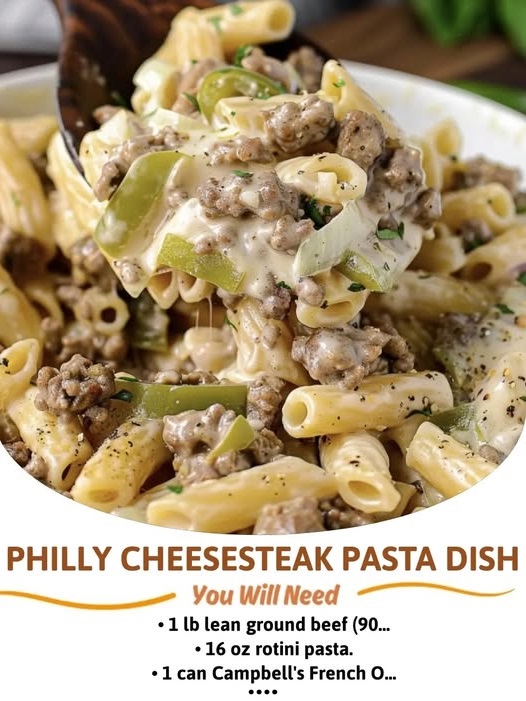 Creamy Philly cheesesteak pasta with sliced steak, bell peppers, onions, and melted cheese over tender pasta.