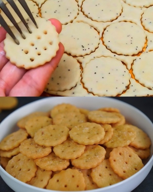 A mix of golden-brown salt crackers and lightly sugared salt cookies arranged on a rustic wooden board.