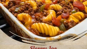 Sloppy Joe casserole topped with melted cheese in a baking dish, served hot.