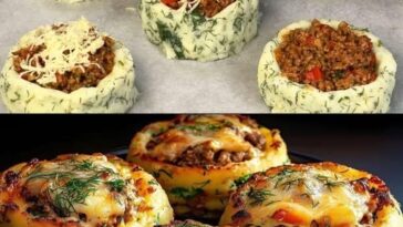 "A close-up of golden-brown stuffed mashed potato nests, filled with melted cheese and vegetables, arranged neatly on a baking tray."