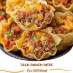 Mini taco ranch bites topped with melted cheese and fresh herbs on a serving platter.