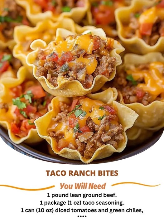Mini taco ranch bites topped with melted cheese and fresh herbs on a serving platter.