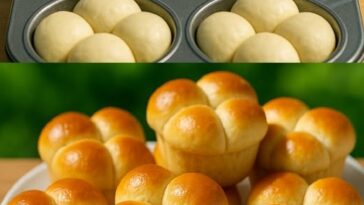 Golden-brown cloverleaf dinner rolls in a baking dish, with a soft, fluffy texture and lightly brushed with melted butter.