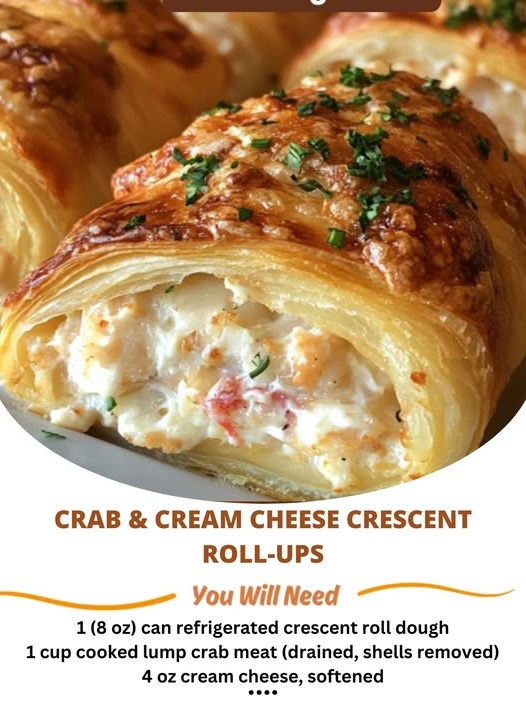 Flaky crescent rolls filled with creamy crab and cheese, arranged on a white platter.
